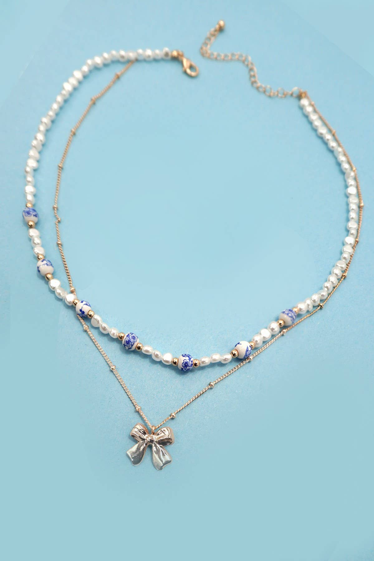 CERAMIC PORCELAIN PEARL BOW LAYER NECKLACE