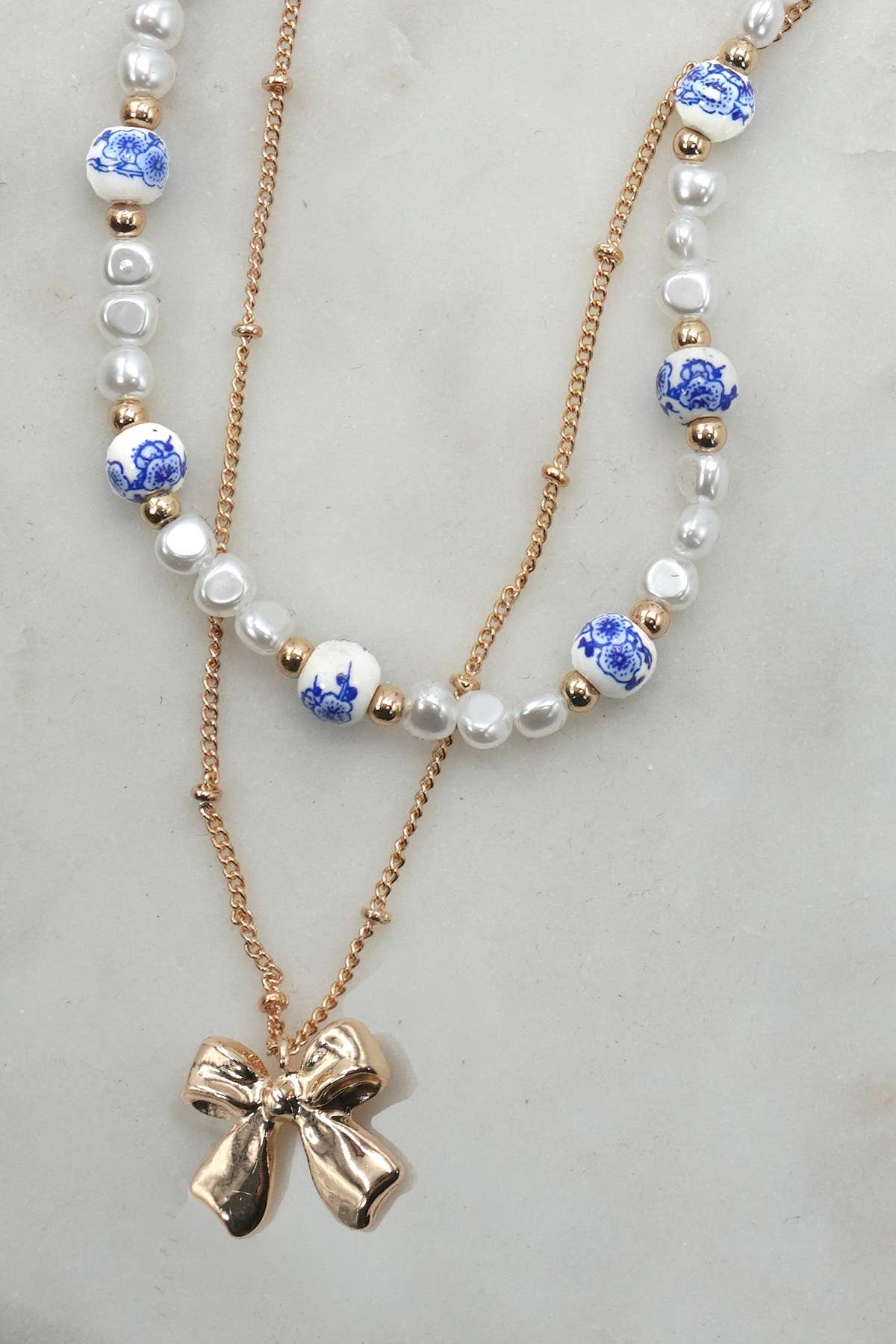 CERAMIC PORCELAIN PEARL BOW LAYER NECKLACE